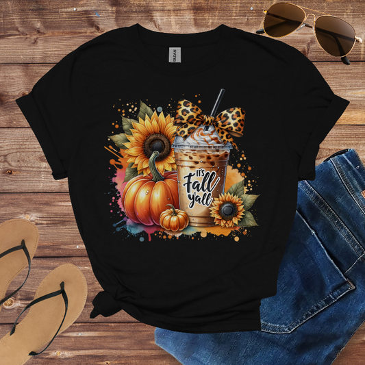 Black t-shirt with autumn design featuring pumpkins, sunflowers, and a coffee cup on a wooden surface.