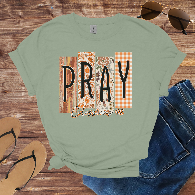 Sage t-shirt with patterned blocks spelling “PRAY” and the text “Colossians 4:2.