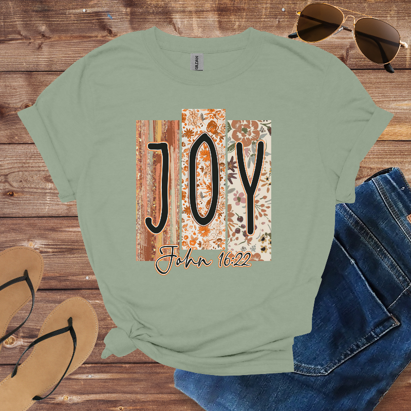 Sage t-shirt with floral-patterned blocks spelling “JOY” and the text “John 16:22.