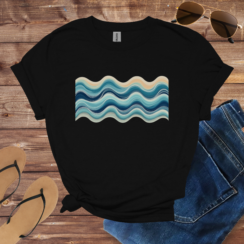 Black t-shirt with wavy blue and beige design on a wooden surface with sunglasses, jeans, and flip-flops.