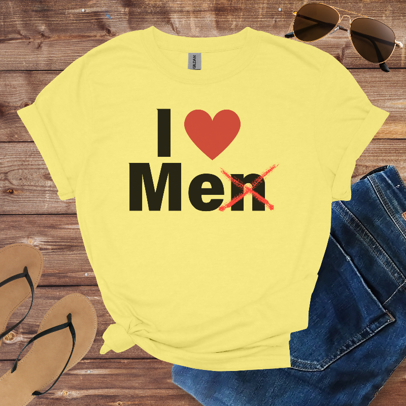 Yellow t-shirt with 'I ❤️ Men' text on a wooden surface with sunglasses, jeans, and sandals.