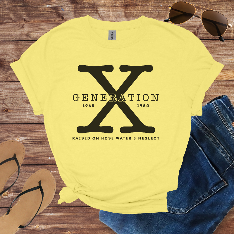 Yellow t-shirt with 'Generation X' design on a wooden surface with sunglasses, jeans, and flip-flops.