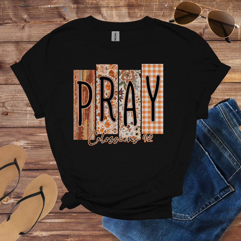 Black t-shirt with patterned blocks spelling “PRAY” and the text “Colossians 4:2.