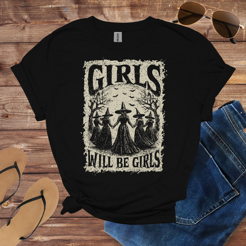 Black t-shirt with a graphic of four witches and the text "Girls Will Be Girls."